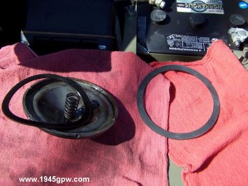 Remove the old oil filter seal from the lid, and prepare the new seal. I will coat the new seal with a little oil before placing on the lid.